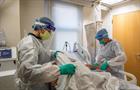 Emergency room doctors and nurses treat covid-19 patient