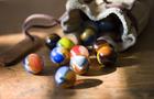 Image of a bag with marbles spilling out