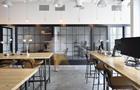 Office space with blurred figures walking in time lapse photography