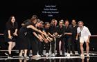 The team behind Lucky Yatra by FCB India for Indian Railways on stage at Cannes holding the Grand Prix PR Lions trophy