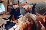 Surgeons implant electrodes for deeper brain stimulation of a patient's subthalamic nucleus (photograph: spl)