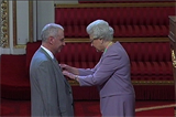 Dr Kingsland receives his honour from the Queen