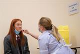 School girl receives the flu vaccination