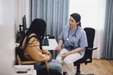 Female GP consulting with a female patient