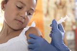 Girl receiving vaccine