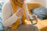 Woman taking an antibiotic