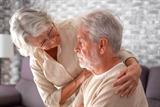 Older woman comforting her husband