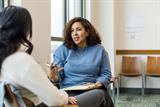 Female healthcare worker in discussion with a woman