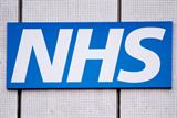 NHS logo on tiled wall