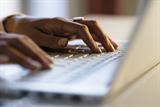 Person typing on computer