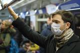 Man wearing mask on train