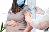 Pregnant woman receives COVID-19 vaccine