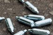 Canisters dumped in the street, Photograph: Adam Webb/Getty Images