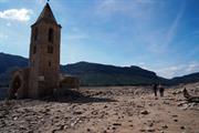 A once-flooded monastery resurfaces after drought strikes Spain, September 2022. Vince argues intolerable heat in the coming years could lead to mass migration from southern to northern Europe. Photo: Ahmet Abbasi/Anadolu Agency via Getty Images