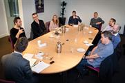 Participants debating at the RAB Roundtable