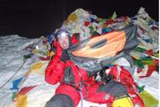 Kenton Cool: unveils the Oystercatchers flag on the summit of Everest 
