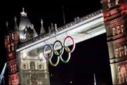 Olympic rings:hoisted into place on Tower Bridge