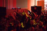 The audience applaud Queen by chanting We Will Rock You
