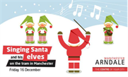 Singing Santa flash mobs Manchester commuters