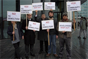 Residents protest the planned demolition