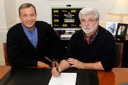 Disney chairman and CEO Bob Iger (l) and George Lucas