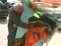 Baghdad: image sof Saddam Hussein are being defaced