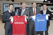 Leyton Orient: chairman Barry Hearn second from left and new sponsored club shirts