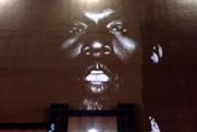 Projection Advertising behind Kanye West video stunt