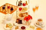 The afternoon tea features edible scrabble pieces and chocolate Monopoly hats