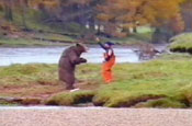 John West reprises bear v fisherman fight scene