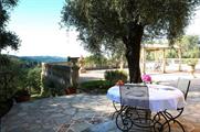 The villa includes a pool and spacious outdoor area (airbnb.co.uk)