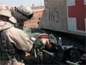 Crossing the Euphrates: wounded Iraqi soldier receives treatment from US medic