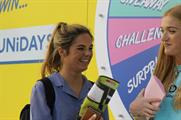 Students will 'spin to win' for the chance to enter the container and try a secret challenge for a prize