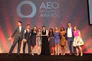 Jimmy Carr on stage with AEO Awards winners