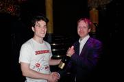 Jollyboat's Tommy Croft presented with Champagne by Intervino's Matthew Young