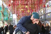 Christmas shoppers kiss to power Borough Market's festive lights display
