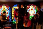 Communion Bar features handmade stained glass windows and church furniture