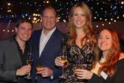 Guests sip on bubbly at Event's 2013 Christmas party