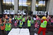 Children join Greenpeace in playful protest stunt