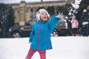 Kids and families enjoy the snow, created by Land Rover at Alexandra Palace