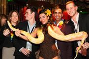 Guests with a snake charmer at the Late Night London showcase
