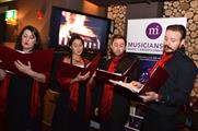 Christmas carolers at LNL's Christmas showcase