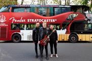 Competition winners Violet Bones in front of Fender-inspired bus