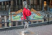 Amy Winehouse and Sherlock Holmes statues wrapped in red coats for Wrap Up London