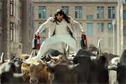 A bewigged Jason Statham 'bull surfs' in a Statham fantasy world for bizarre LG spot