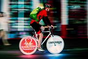 Bespoke ad: the pk10 logo is projected during the charity night ride 