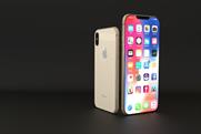 Apple signals greater role for ad revenue as iPhone sales drop 15%