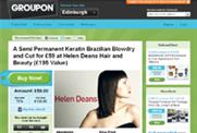 Groupon trims losses to $3.59m