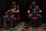 Men tries virtual reality Samsung Gear VR headset at 2016's VRLA.