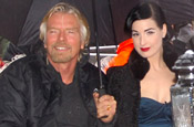 Branson (with Dita Von Teese): the tycoon is squaring up to arch-rival Sky 